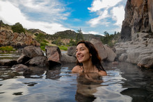 Female Hiker Bathing In Primitive Hot Springs On Colorado River
Radium, Grand County, Colorado, USA
