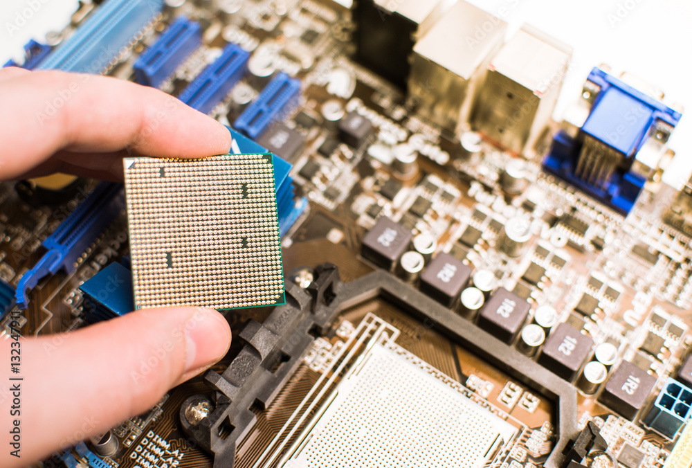 Installing the CPU into the motherboard Stock Photo | Adobe Stock