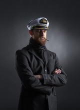 Portrait Of A Handsome Sailor On A Dark Background