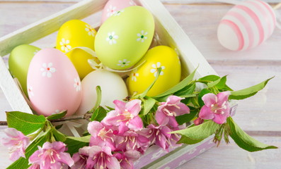  Easter eggs and Japanese rose flowers in bloom