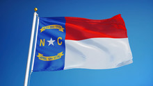North Carolina (U.S. State) Flag Waving Against Clear Blue Sky, Close Up, Isolated With Clipping Path Mask Alpha Channel Transparency, Perfect For Film, News, Composition