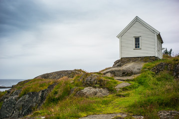 Fisherman's house on the rocks in the Norwegian fishing town.