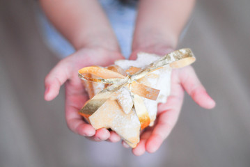 homemade cookies made by a little girl in the hands of