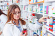 © Karanov images - Close up shot of a professional pharmacist checking stock in an aisle of a local drugstore.