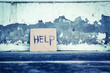 Help sign paper on the grungy wall,poverty concept and ideas