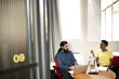 © Andy Paul - Multi ethnic business colleagues in an office meeting room