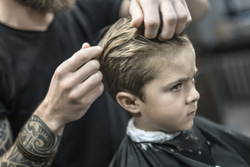 Kid's hair styling in barbershop