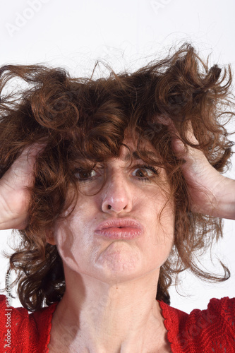 Fotografie, Obraz Woman who disheveled in a background white color
