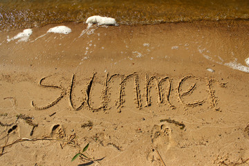 Wall Mural - Inscription summer on the sand by the sea with waves