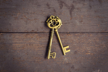 Wall Mural - Old key vintage on wood background and texture with space.