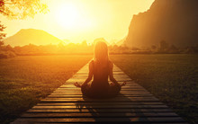 Serenity And Yoga Practicing At Sunset, Meditation