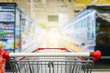 © nonnie192 - Supermarket aisle with empty red shopping cart