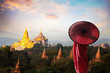 Monk standing with holding umbrella, Bagan Mandalay Myanmar