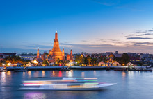 The Boat Was Sailing In Chao Phraya River, Background Wat Arun At Sunset Time ,Bangkok, Thailand. The Temple Of Dawn