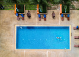 Fototapeta Sawanna - Top view of swimming pool ,Man swim in the pool