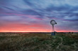 © tonyng - Beautiful sunset falling behind a windmill.