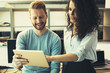 © NDABCREATIVITY - Happy business colleagues in modern office