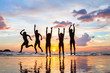© Song_about_summer - group of people jumping on the beach at sunset, silhouettes of happy friends on holidays