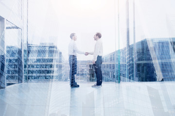 Wall Mural - business deal or cooperation concept, two businessman handshake