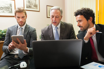 Canvas Print - Business people at work in their office