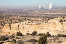 Sandstone Bluffs And A Coal Fired Power Plant In New Mexico