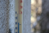Fototapeta  - Thermometer outside the window winter