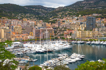 Wall Mural - Principality of Monaco. View of the seaport and the city of Monte Carlo with luxury yachts and sail boats 
