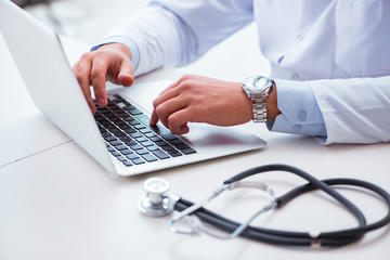 Wall Mural - Doctor working on the computer