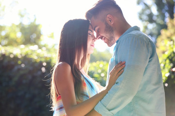 Wall Mural - Lovely couple hugging on street