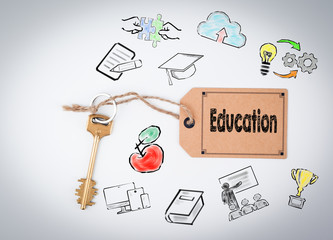 Wall Mural - Education. Key and a note on a white background 