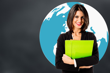 smiling business woman with green folder on gray background and earth globe