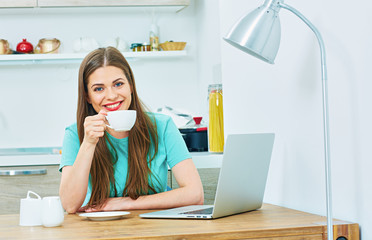 Wall Mural - woman work at home kitchen with laptop