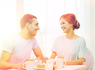 Sticker - smiling couple having breakfast at home