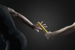 © PhotoAlto - Runners passing baton, cropped