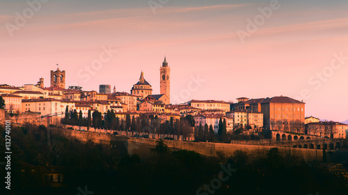 Cuadros en Lienzo Bergamo Alta old town colored af sunset's lights - Lombardy Italy