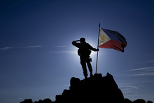Soldier On Top Of The Mountain With The Philippine Flag