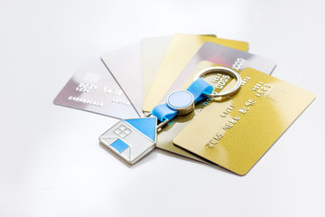 credit cards, key ring - concept mortgage on white background