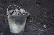 © Alex_Po - Old bucket with lumps of coal