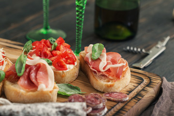 Sticker - Set of small sandwiches with prosciutto, tomatoes, fresh basil