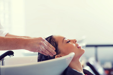 Wall Mural - happy young woman at hair salon