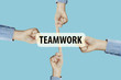 © Thermchai - Many hands fingers pointing with index fingers to TEAMWORK text