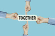 © Thermchai - Many hands fingers pointing with index fingers to TOGETHER text
