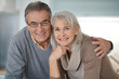 © goodluz - Portrait of senior couple looking at camera