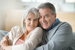 © goodluz - Portrait of senior couple relaxing in sofa