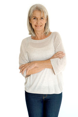 Wall Mural - Senior woman standing on white background