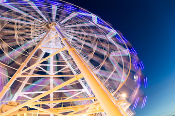 Wall Mural - Ferris wheel moving at night