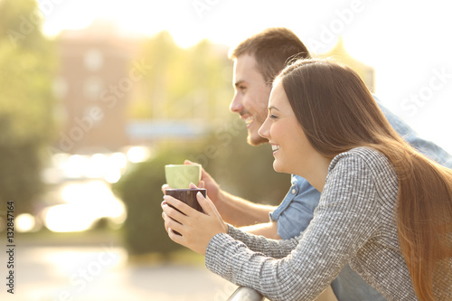 Fotografie, Obraz Happy couple enjoying breakfast in a balcony