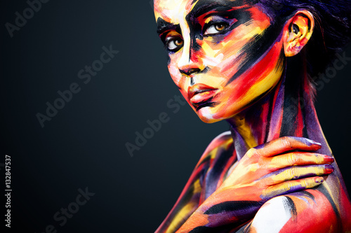 Naklejka na meble Portrait of the bright beautiful girl with art colorful make-up and bodyart