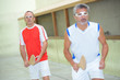 © auremar - Sportsmen playing ball game with wooden bats