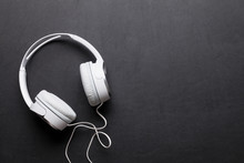 Headphones On Leather Desk Table